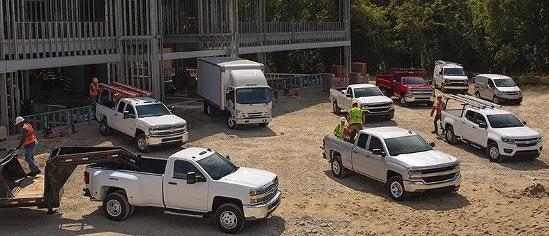 Trucks besides building