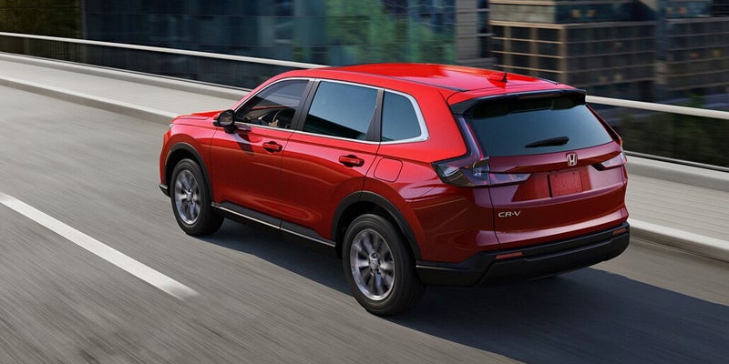 Red CR-V running on road